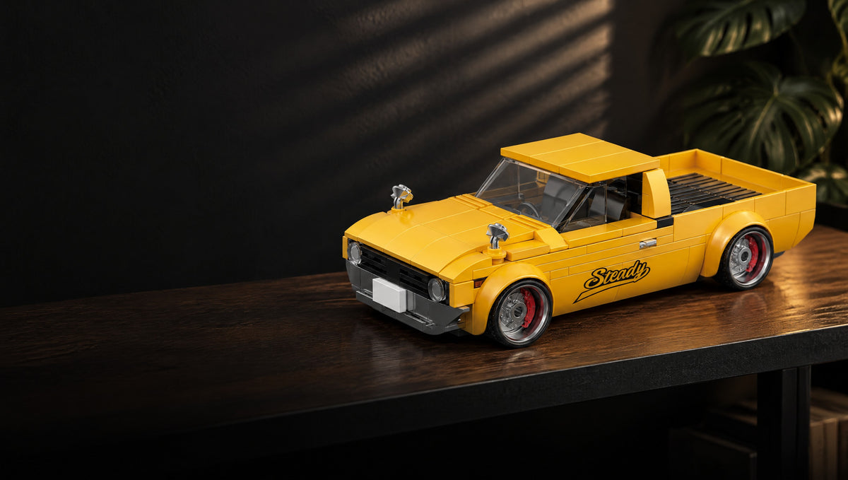 A yellow pickup with a ribbed open bed