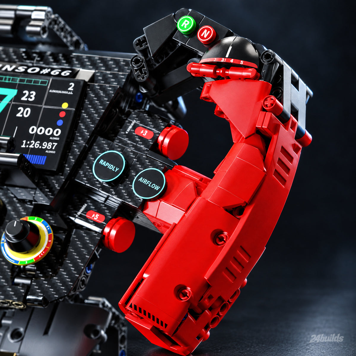 Red Grand Prix Steering Wheel: ribbed red hand grip close-up