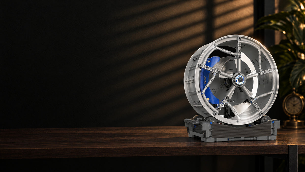 Split silver spokes over a blue caliper