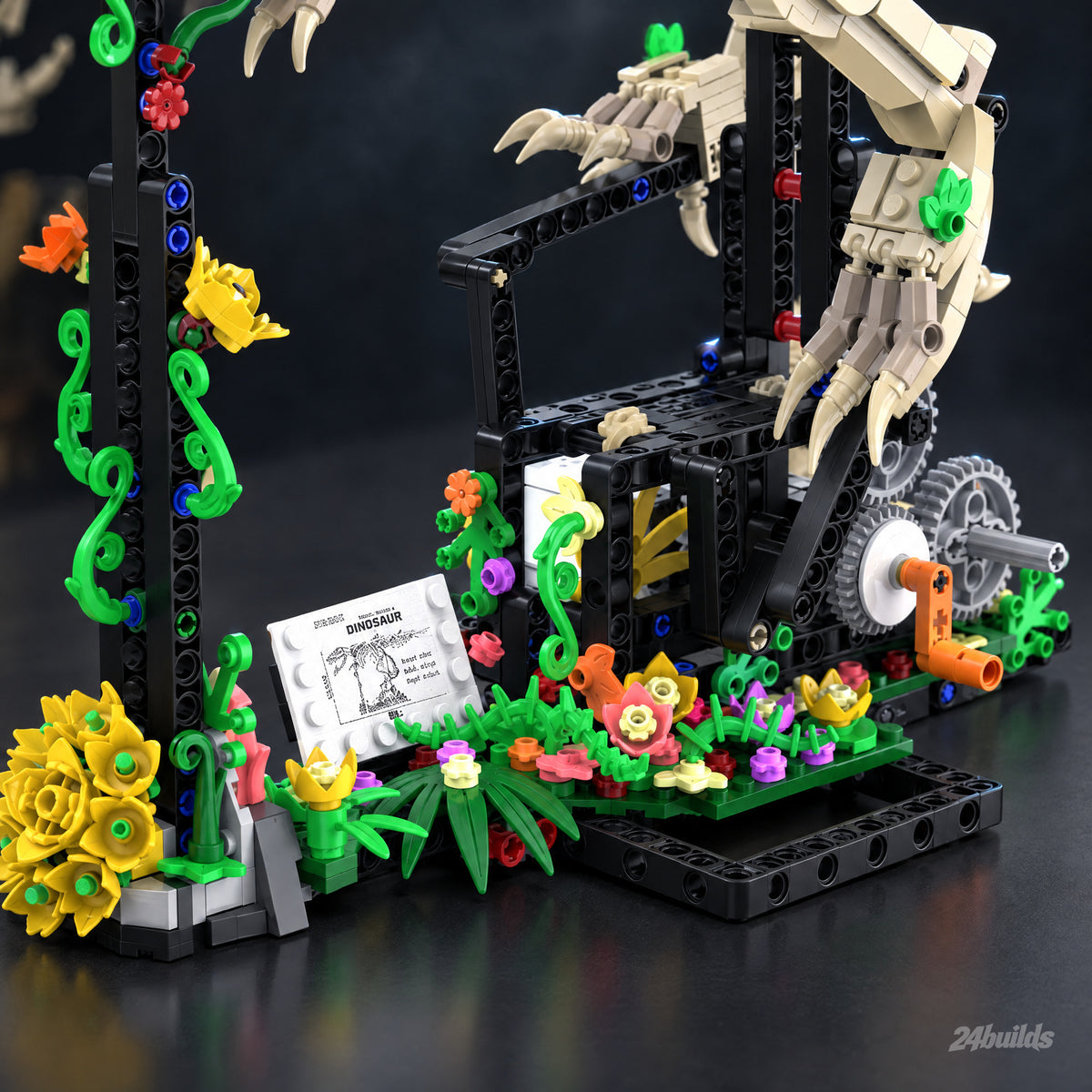 T-Rex Fossil Skeleton brick model, black base with the hand crank, gears, plants and flowers